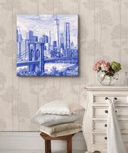 Elegant blue and white toile canvas art featuring the New York City skyline with the Brooklyn Bridge and One World Trade Center. Detailed architectural lines and soft clouds create a timeless, classic cityscape with a vintage fine-art feel.