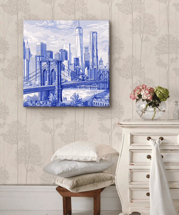 Elegant blue and white toile canvas art featuring the New York City skyline with the Brooklyn Bridge and One World Trade Center. Detailed architectural lines and soft clouds create a timeless, classic cityscape with a vintage fine-art feel.