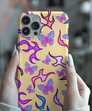 Trendy Y2K-inspired phone case featuring bright pink and blue butterflies surrounded by purple and magenta flame shapes on a soft beige background. A bold, nostalgic design perfect for butterfly lovers and retro aesthetic fans.