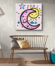Canvas art featuring a pastel pink crescent moon hugging a smiling yellow sun surrounded by teal stars, clouds, and doodle-style accents. The playful celestial design adds a dreamy, whimsical touch perfect for cozy or boho-inspired interiors.