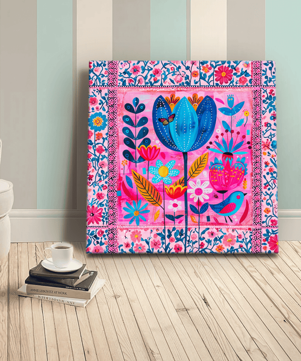 Vibrant boho-style canvas art with a whimsical floral pattern in bold shades of pink, blue, yellow, and orange.  The folk-inspired design features blooming flowers, leaves, and a small bird framed by a floral border, perfect for brightening eclectic or artistic home décor.