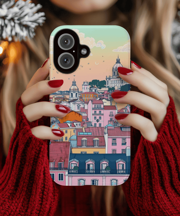 A pastel-toned phone case featuring a dreamy Lisbon cityscape with colorful rooftops, domed churches, and sunset skies in soft peach, mint, and pink hues, blending architecture and art in a whimsical travel aesthetic.