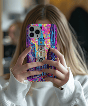 Bold and colorful phone case featuring Philadelphia’s City Hall in a neon geometric art style. The vivid design uses bright shades of pink, purple, blue, and yellow to create a modern urban aesthetic perfect for city lovers and travel-inspired tech accessories.