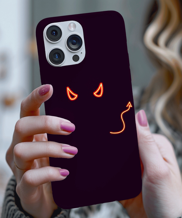 Black phone case featuring glowing red neon devil eyes and a curved tail design, creating a sleek and mischievous aesthetic. The minimal glowing art gives off a dark, bold, and edgy vibe perfect for alternative fashion lovers.