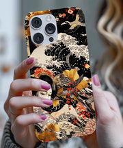 A Japanese-inspired phone case featuring a graceful geisha surrounded by ocean waves, cranes, and golden florals on a black background, blending traditional ukiyo-e art with modern elegance.