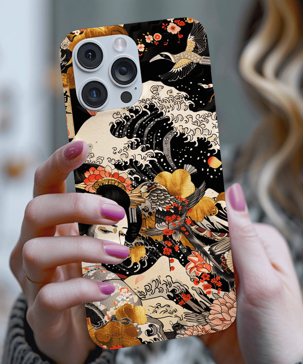 A Japanese-inspired phone case featuring a graceful geisha surrounded by ocean waves, cranes, and golden florals on a black background, blending traditional ukiyo-e art with modern elegance.