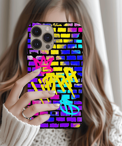 A vibrant phone case featuring the word “Libra” spray-painted in yellow graffiti over a colorful brick wall background, with pink and blue crown and zodiac symbols for a bold street art look.