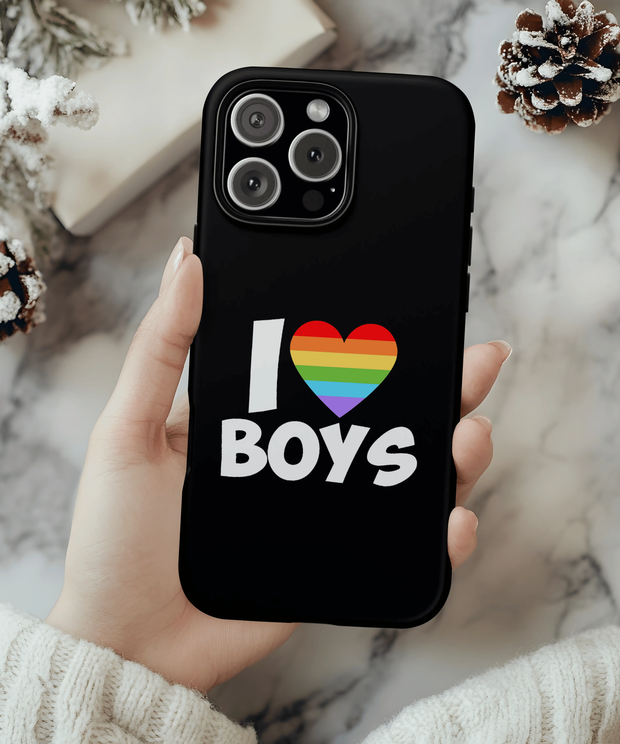 A black phone case with bold white text reading “I ❤️ Boys,” featuring a rainbow-striped heart symbol representing LGBTQ+ pride and celebration of queer love.