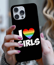 A black phone case with bold white text reading “I ❤️ Girls,” featuring a rainbow-striped heart symbol representing LGBTQ+ pride and queer love in a clean, modern design.