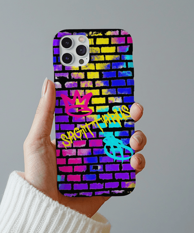 Colorful Sagittarius phone case featuring neon graffiti lettering on a vibrant brick wall background with pink, yellow, blue, and purple spray paint textures. Includes graffiti-style zodiac symbols, perfect for astrology fans who love bold urban streetwear vibes.