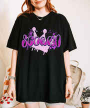 Black oversized t-shirt with bold purple and pink airbrush-style lettering that spells “Scorpio.” The designfeatures paint splatters and a grunge background, perfect for astrology lovers and Scorpio zodiac fanswho love edgy, retro streetwear style.