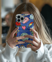 Trendy denim-style phone case covered in colorful Y2K-inspired patches including lips, lightning bolts, mushrooms, hearts, and a “Bad Luck Babe” patch on a faux jean pocket. Playful, nostalgic design perfect for retro fashion lovers and bold, creative personalities.