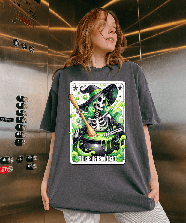 The Shit Stirrer Witch Skeleton Comfort Colors Tee LavenderCeleste